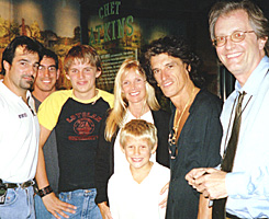 Pictured in front of the museum's Chet Atkins exhibit are Aerosmith assistant tour manger John Bionelli, tutor Phillip Cafferty, Perry's sons Tony and Roman and his wife Billie, Perry, and Country Music Hall of Fame and Museum Director Kyle Young